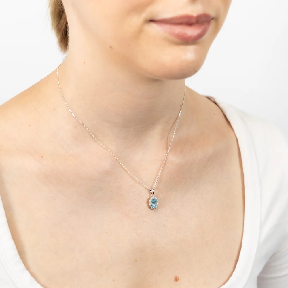 Sterling Silver Rhodium Plated White And Aquamarine Cubic Zirconia Oval Pendant - Image 2